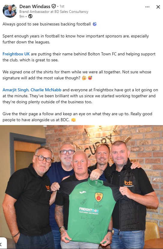 Five former professional footballers holding a signed green Bolton Town FC shirt displaying the club crest and Freightbox UK sponsor logo