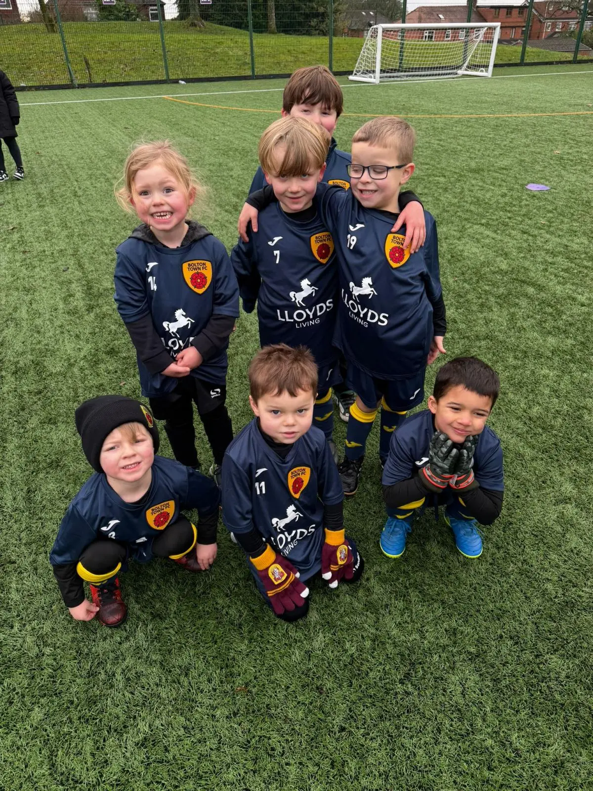 Young Bolton Town players together on the training pitch