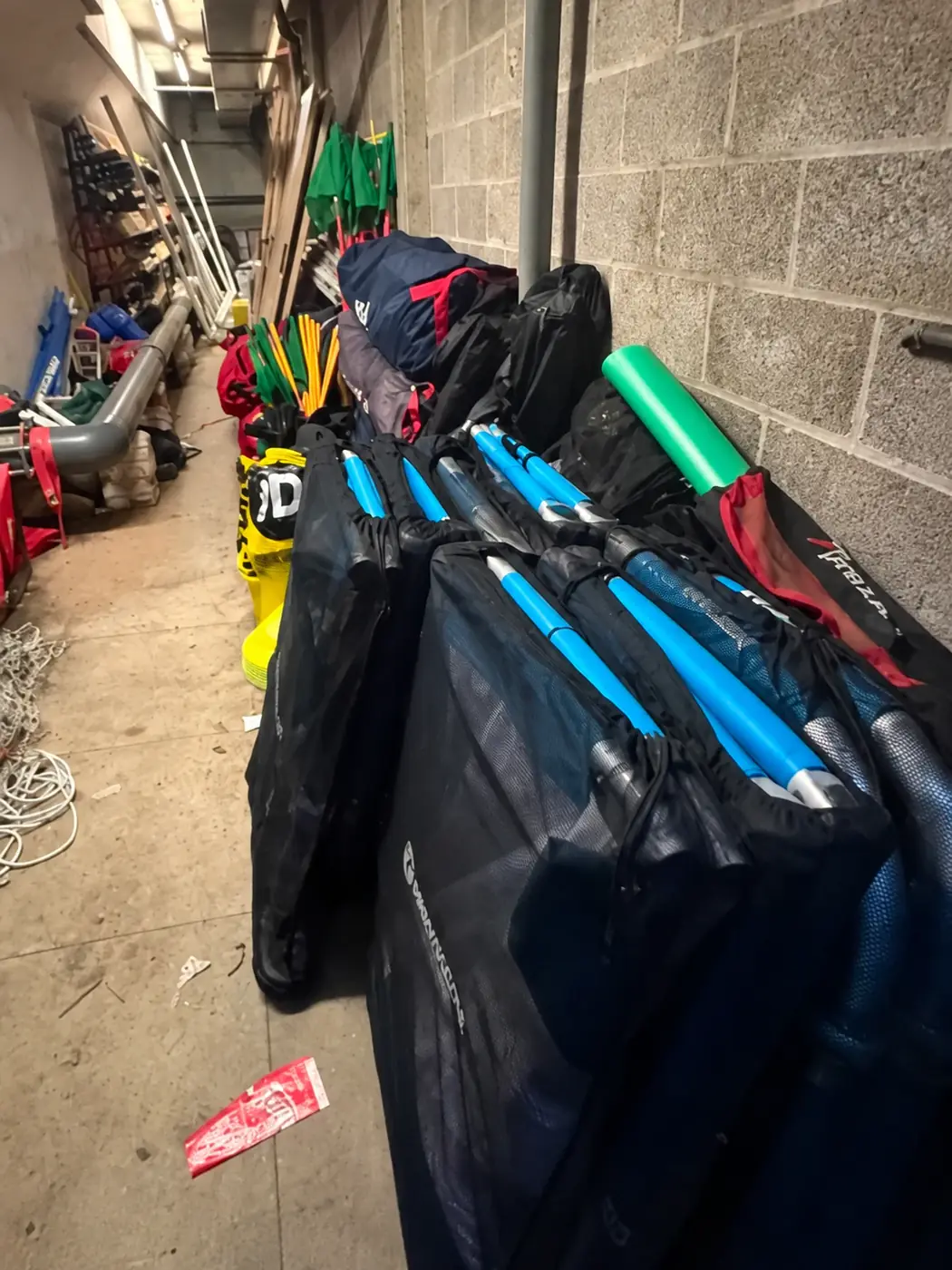 Full storeroom overview showing Bolton Town matchday equipment stored in its correct positions