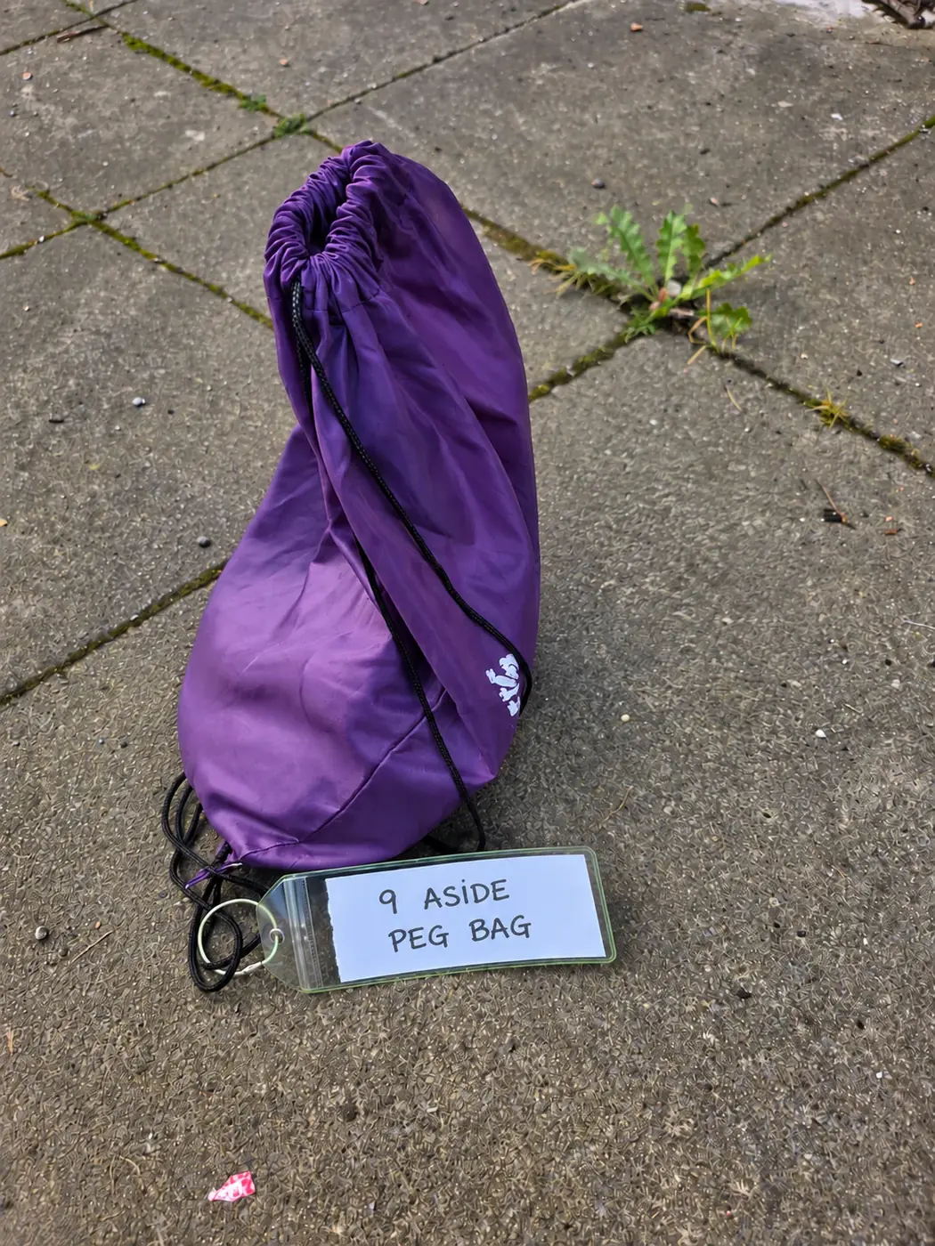 Purple bag labelled 9 ASIDE PEG BAG